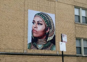 The mural is on a building a few blocks from where Michelle Obama grew up.