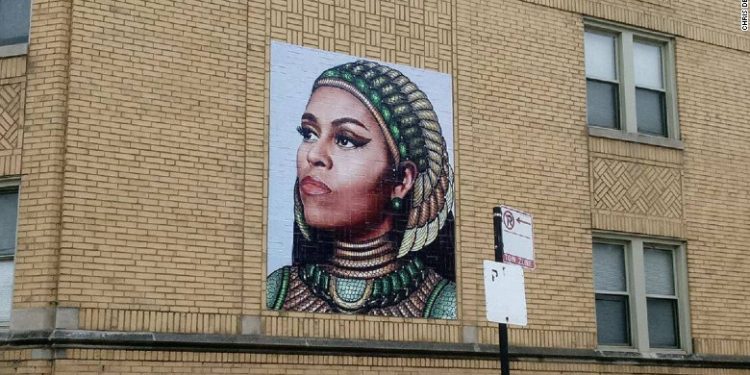 The mural is on a building a few blocks from where Michelle Obama grew up.