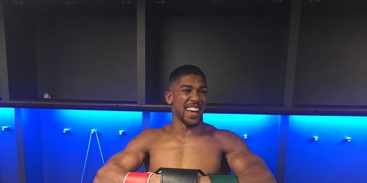Anthony Joshua with his belts