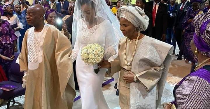 Bishop Oyedepo and wife, walk their daughter, Joy down the wedding aisle (photos)