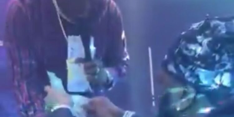 Burna Boy Showers Adewale Ayuba With Dollars During Viral Performance
